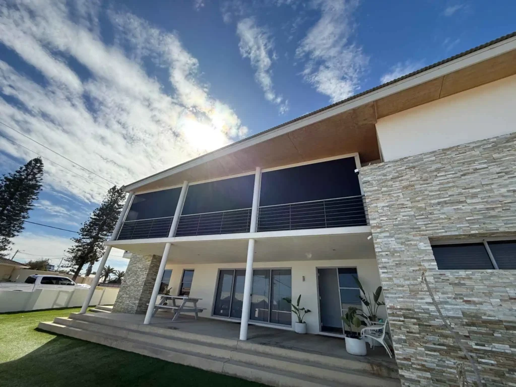 Outdoor blinds installed on a Perth patio providing shade and privacy