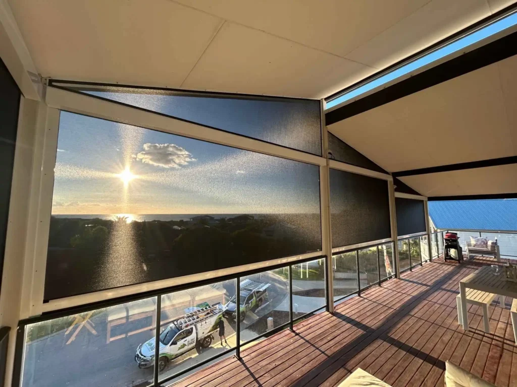 Outdoor blinds shading a living room to reduce indoor temperature