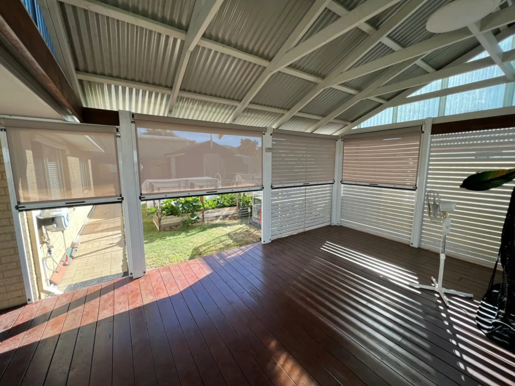 Outdoor blinds blocking wind and enclosing a patio