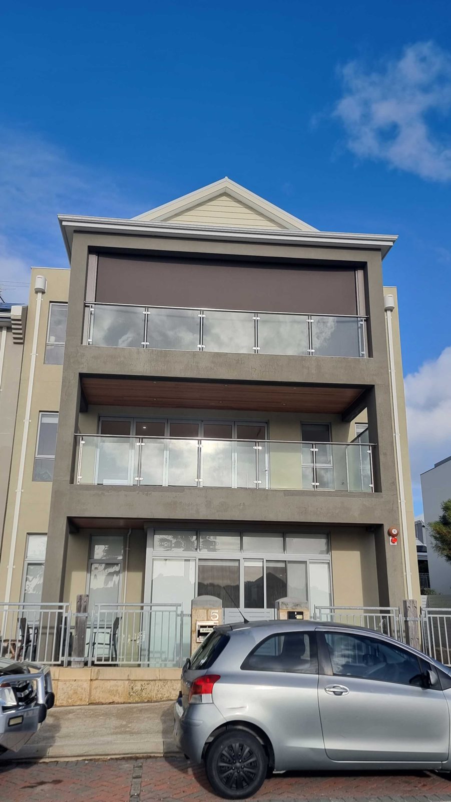 Multi-storey apartment balconies fitted with compliant balcony blinds