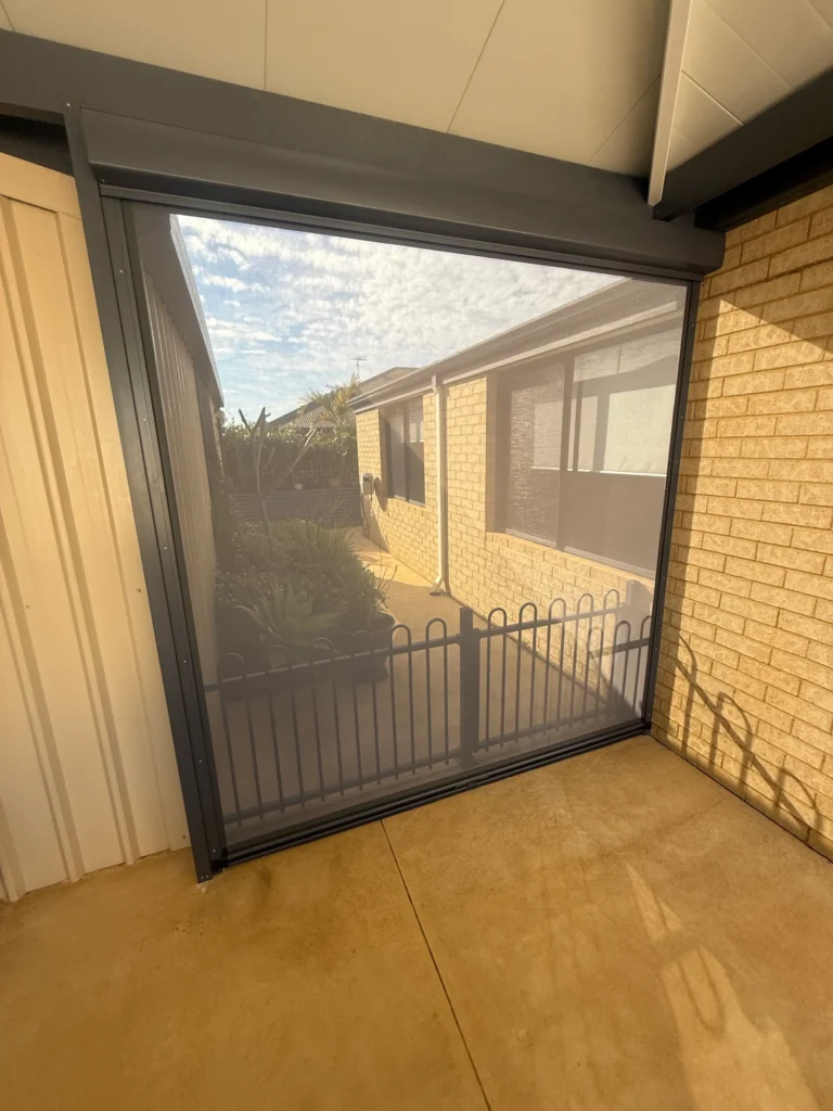 Ironstone Ziptrak outdoor blind closing the open end of a patio in Forrestfield