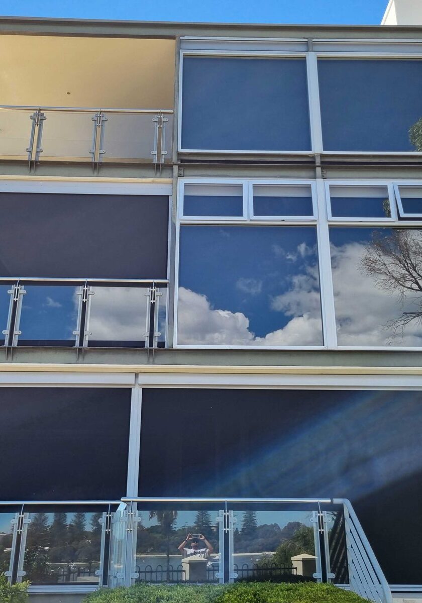 Balcony blinds installed across a multi-storey apartment building in Perth