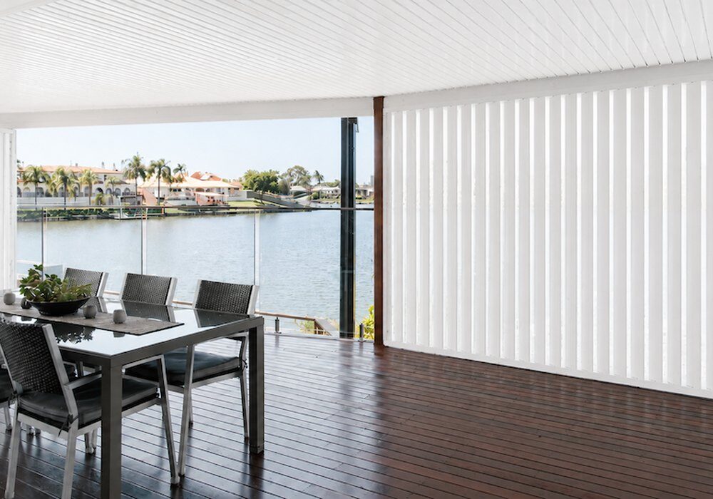 Motorised vertical outdoor shutters on a waterfront entertaining area